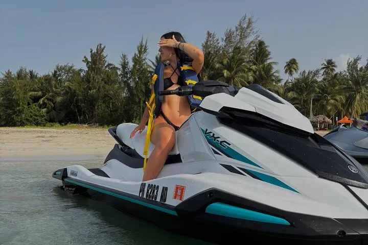 Jet ski off Luquillo beach with the El Yunque mountains behind on a jet ski rental in Puerto Rico